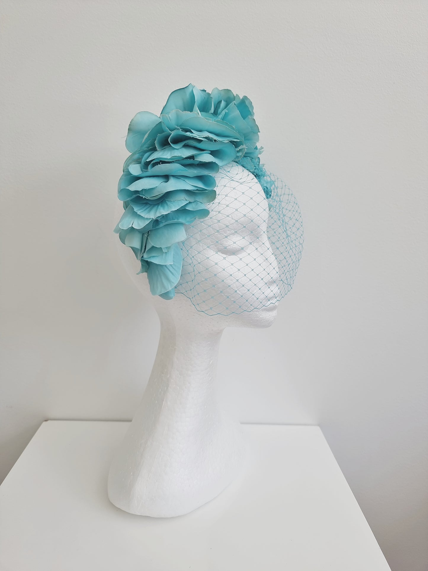 Miss Trixie. Womens ruffle embellished headband with veiling in Tiff Blue