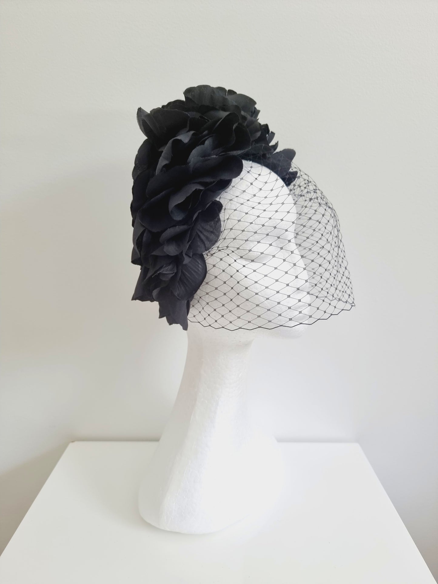 Miss Trixie. Womens ruffle embellished headband with veiling in Black