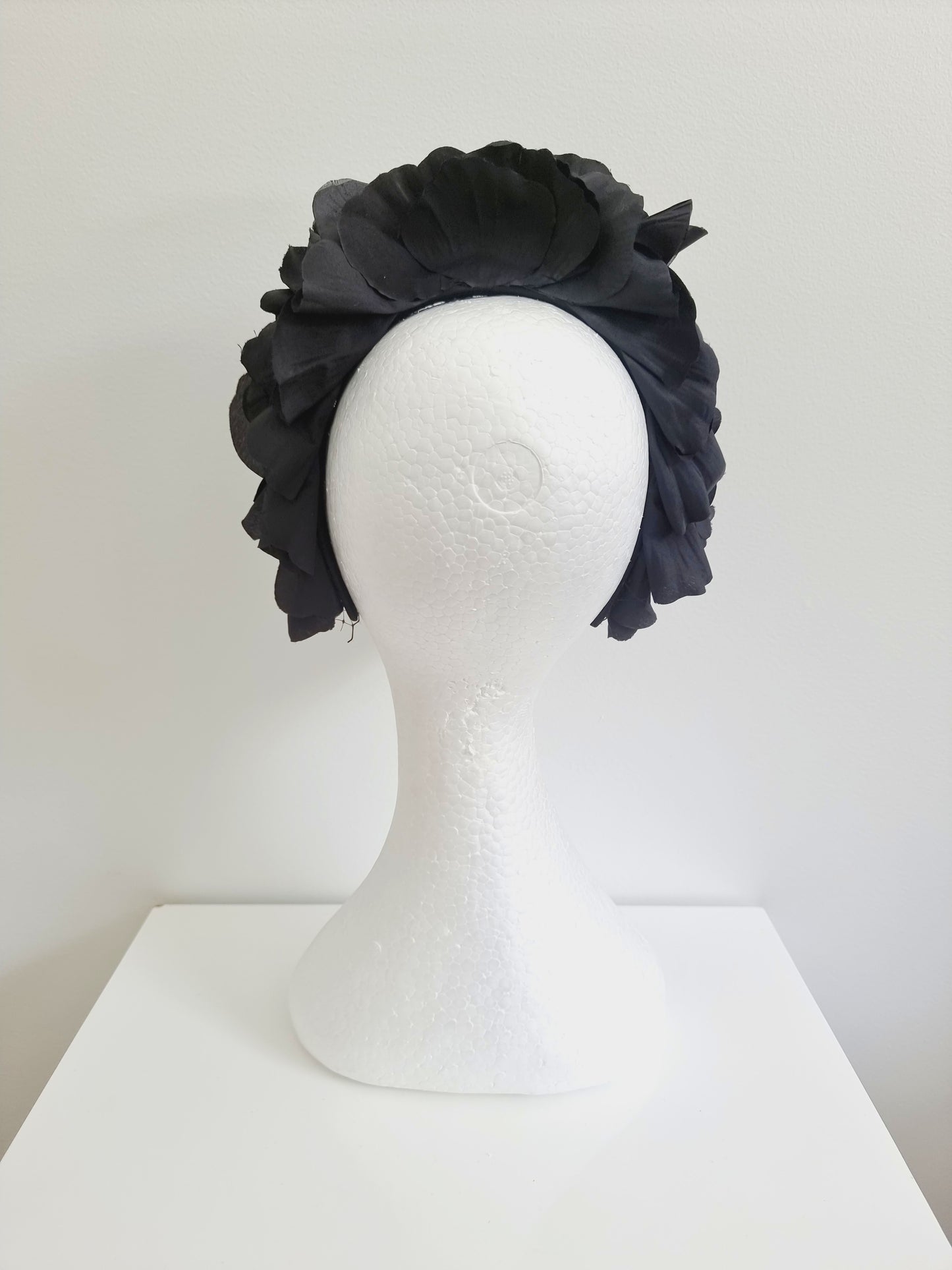 Miss Trixie. Womens ruffle embellished headband with veiling in Black