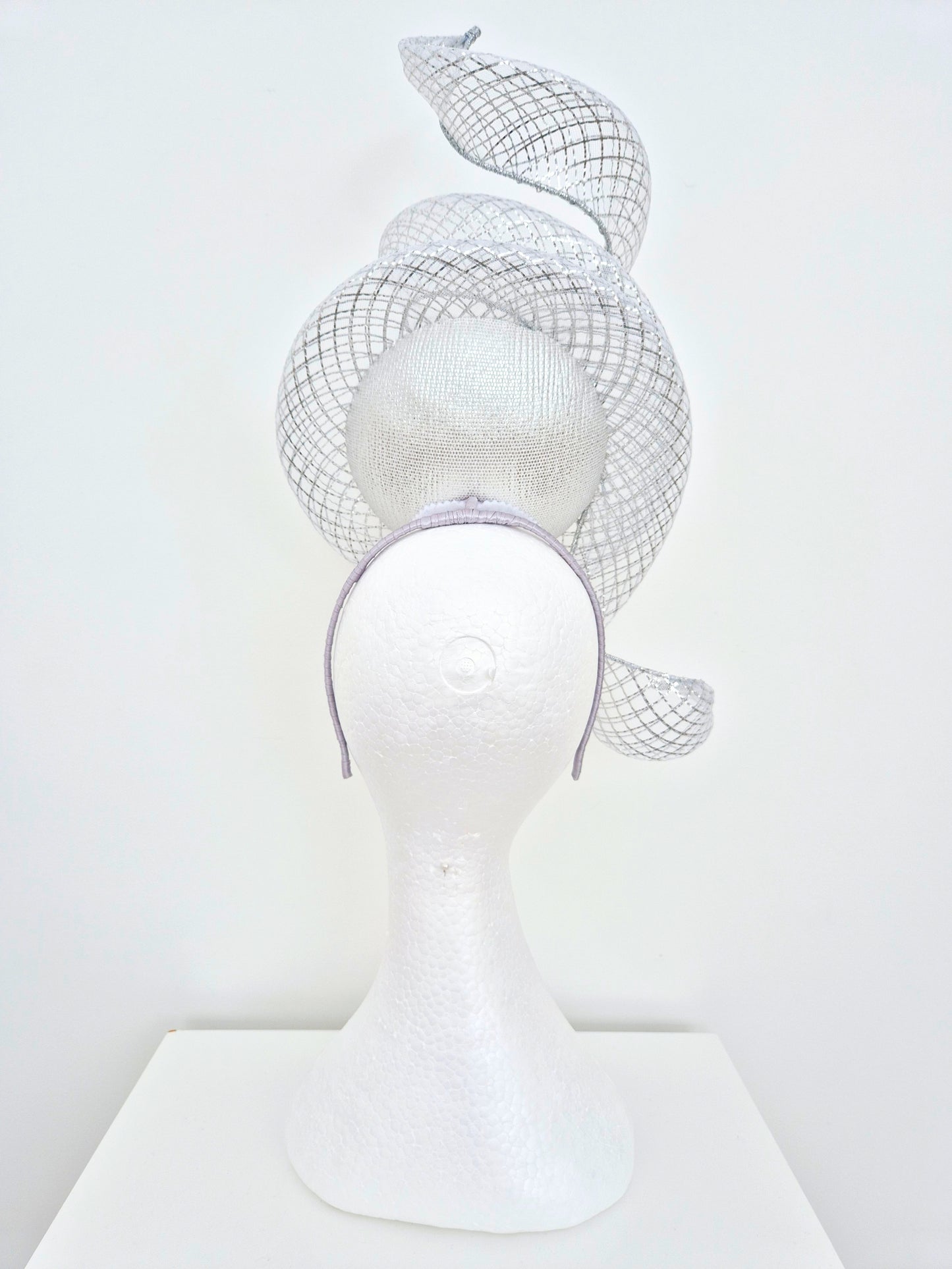 Miss Duke. Womens Silver button percher headband fascinator with crinoline swirl