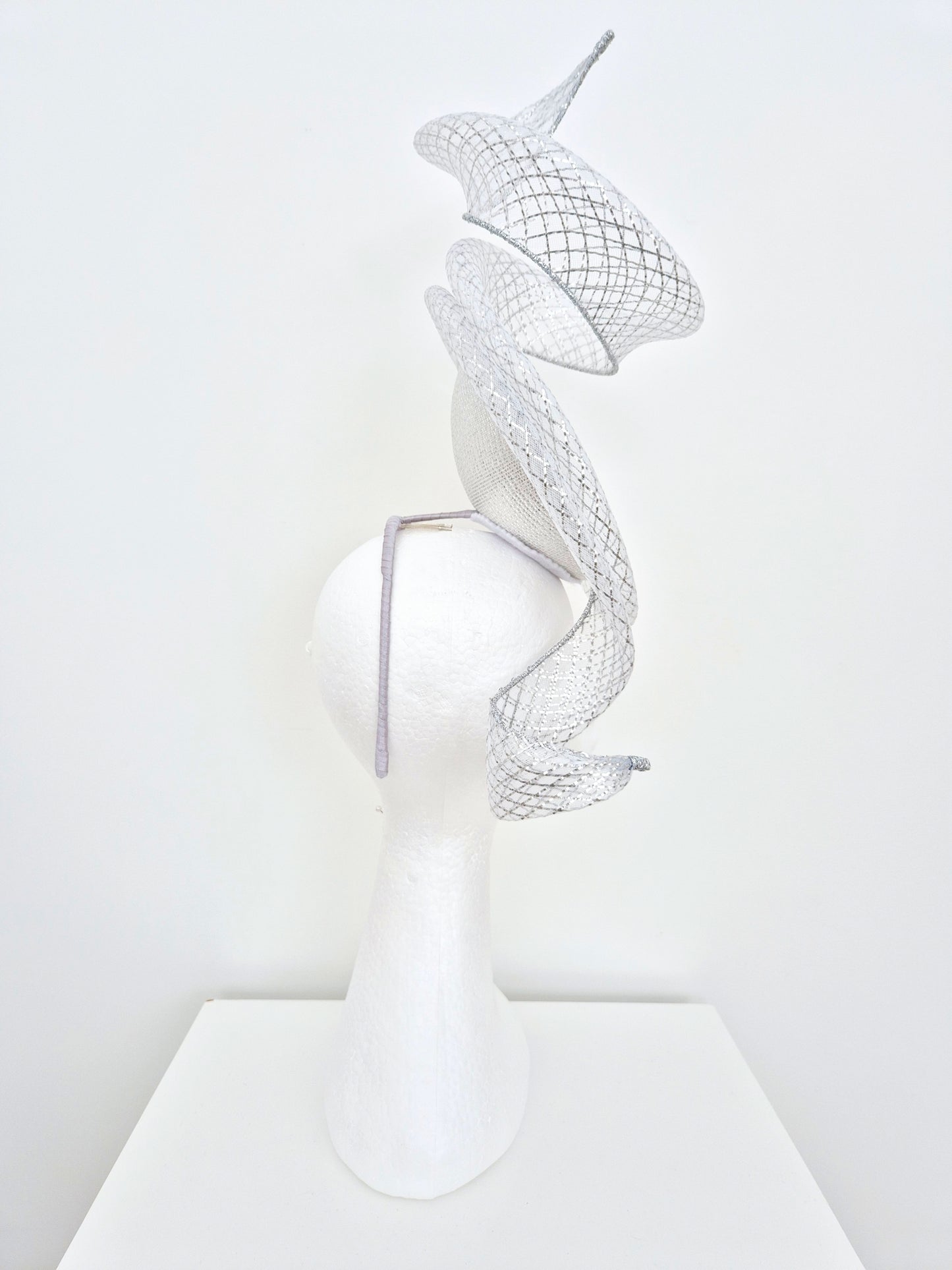 Miss Duke. Womens Silver button percher headband fascinator with crinoline swirl