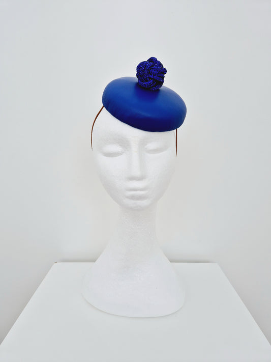 Miss Fia. Womens Royal Blue leather button fascinator with rhinestone knotted ball