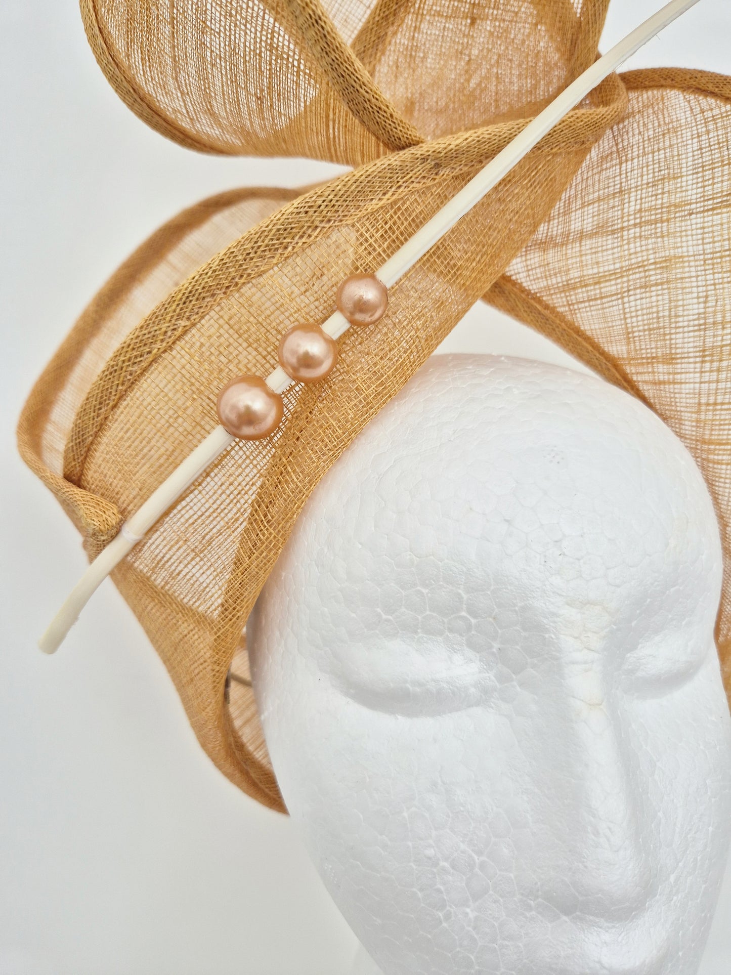 Miss Haze. Womens sinamay twisted turban style headpiece in Sand