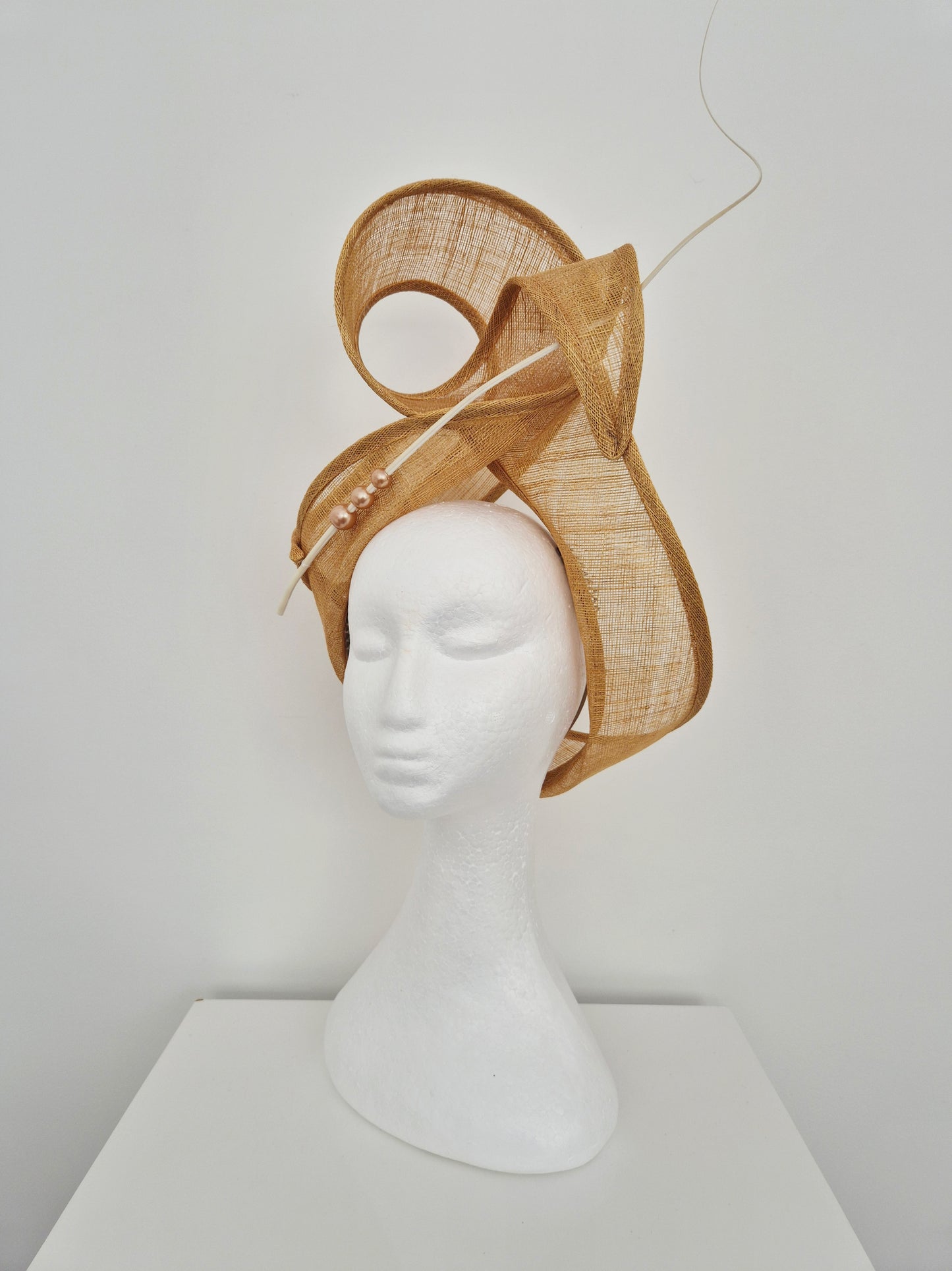 Miss Haze. Womens sinamay twisted turban style headpiece in Sand