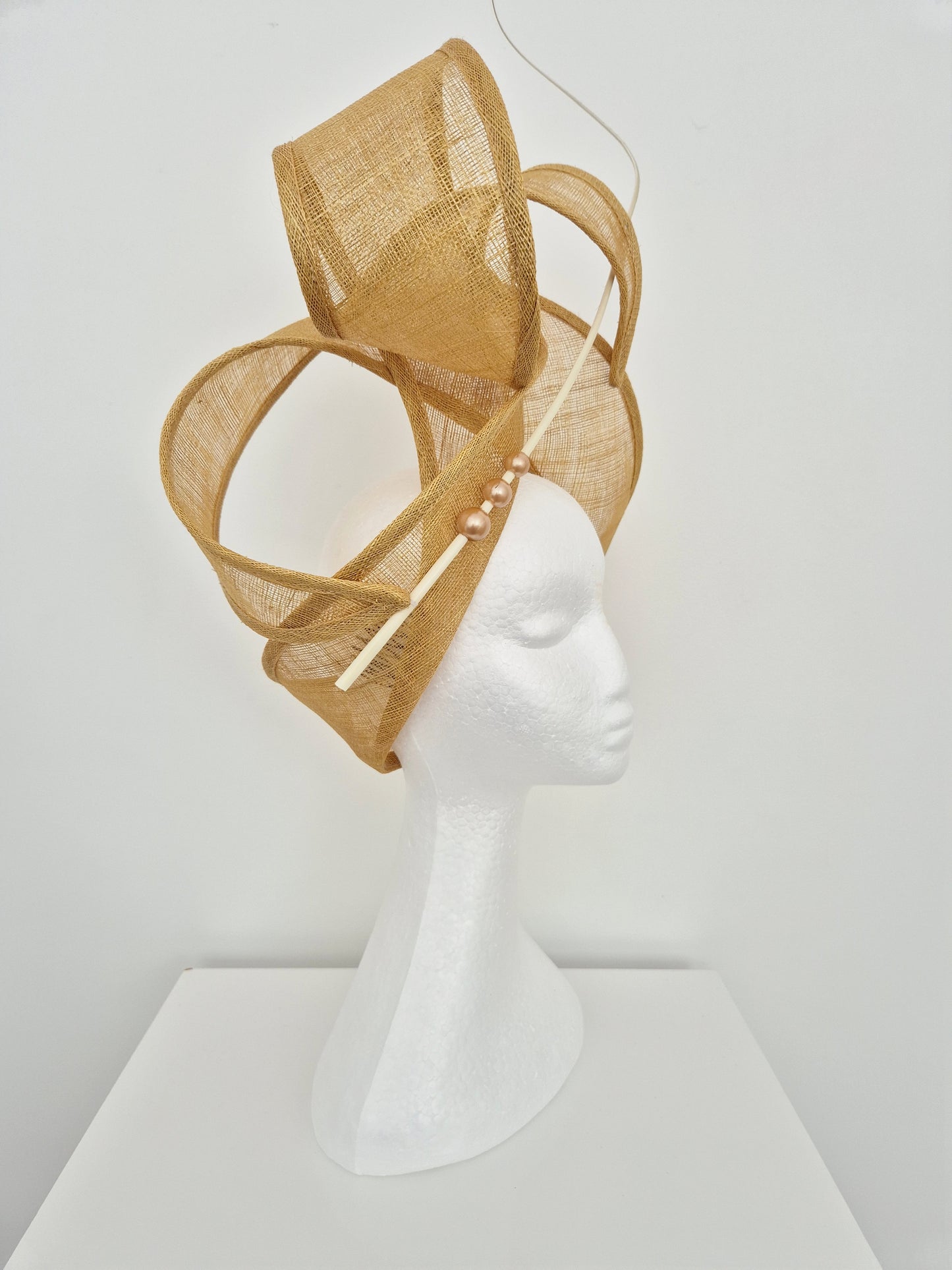 Miss Haze. Womens sinamay twisted turban style headpiece in Sand