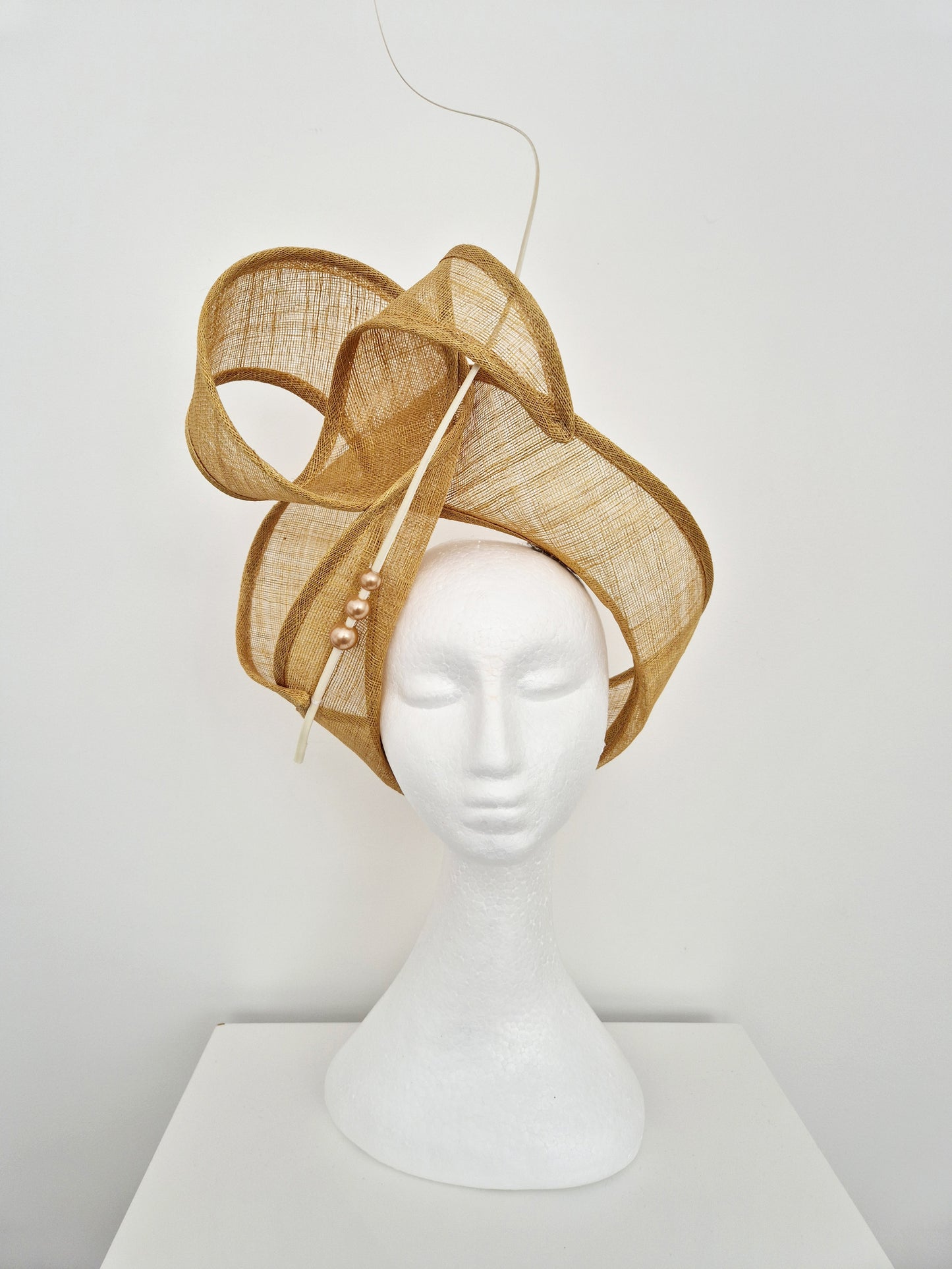 Miss Haze. Womens sinamay twisted turban style headpiece in Sand