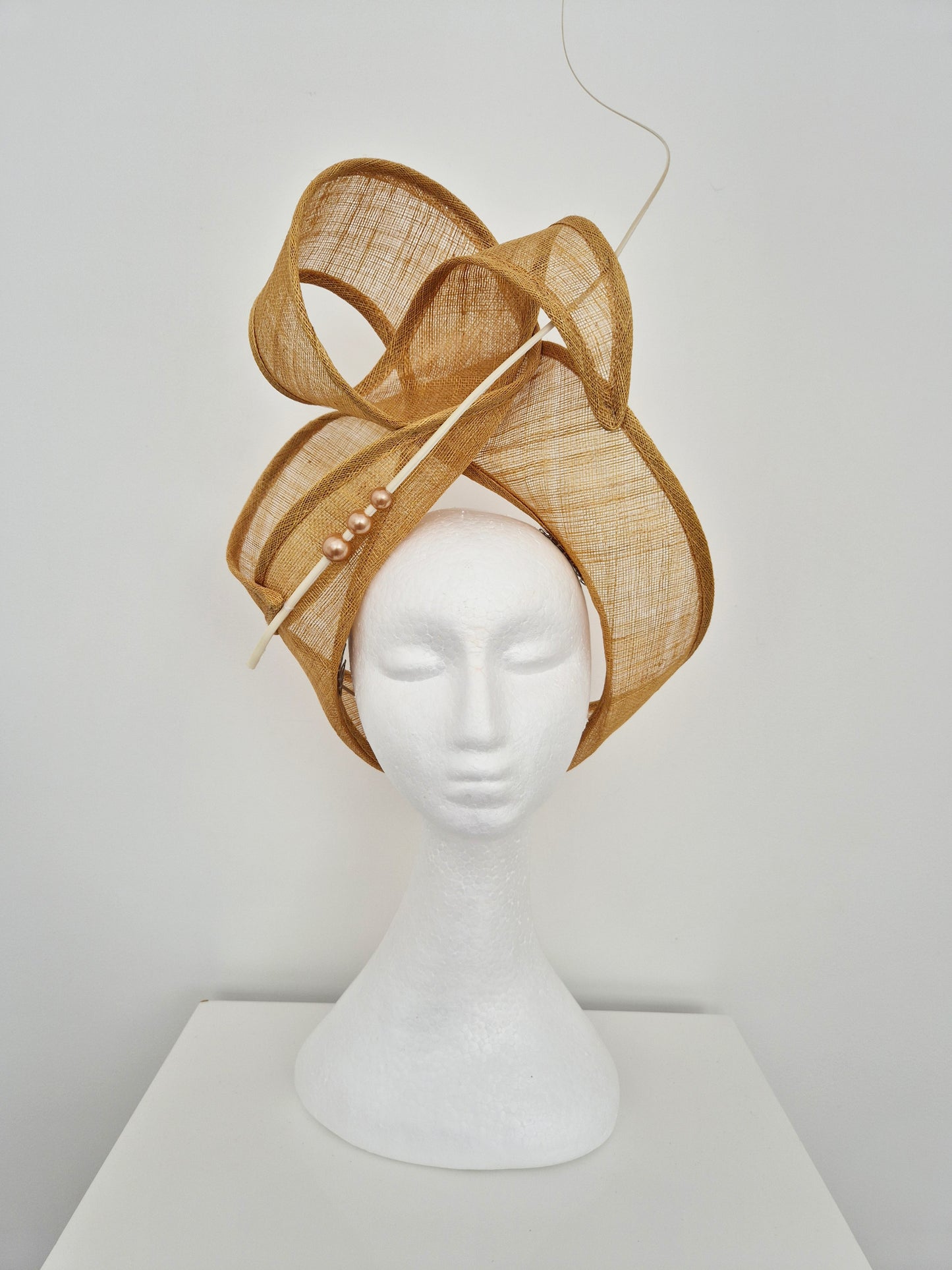 Miss Haze. Womens sinamay twisted turban style headpiece in Sand