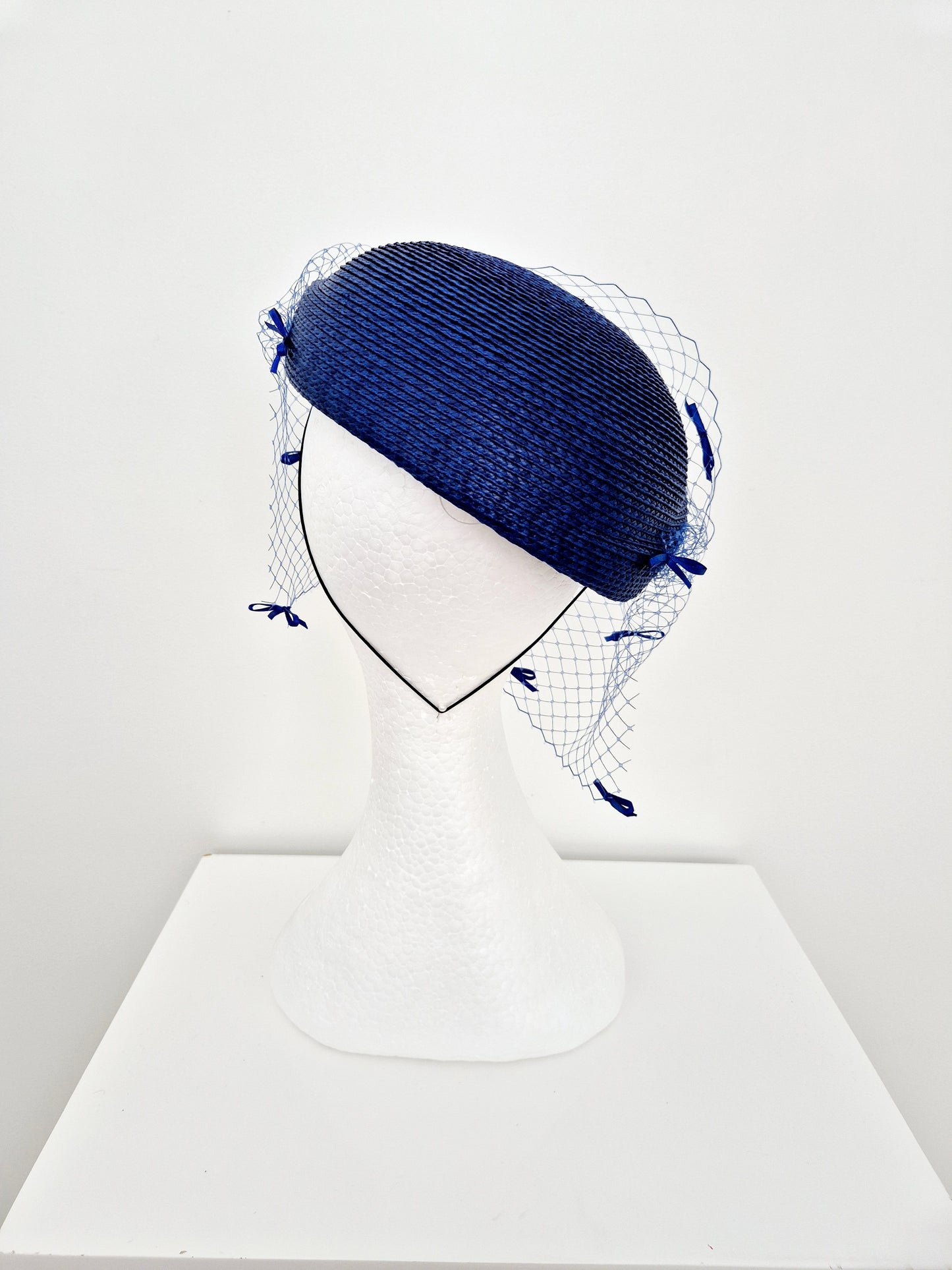 Miss Bella. Womens Royal Blue headpiece with veiling and bows