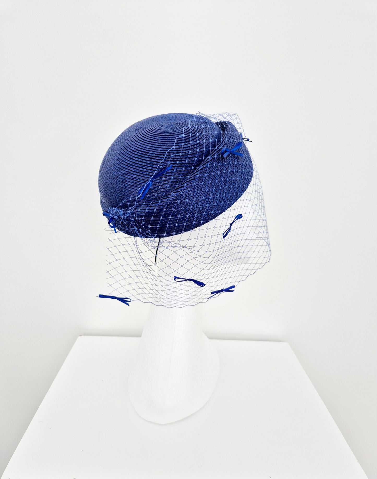 Miss Bella. Womens Royal Blue headpiece with veiling and bows