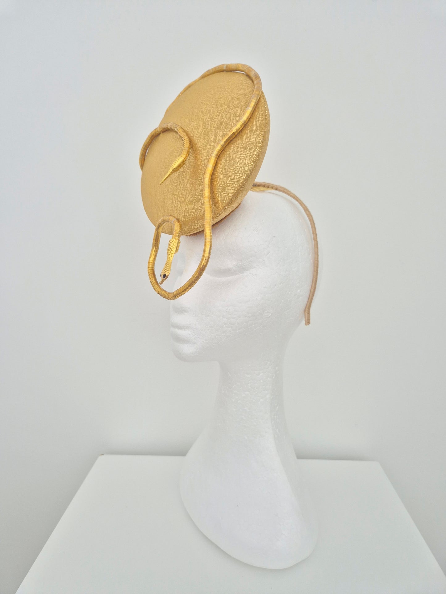 Miss Zendaya. Womens gold button percher headband fascinator with serpent